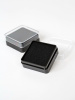 Пластиковый футляр (38х38х17 мм). Чёрное основание, прозрачная крышка